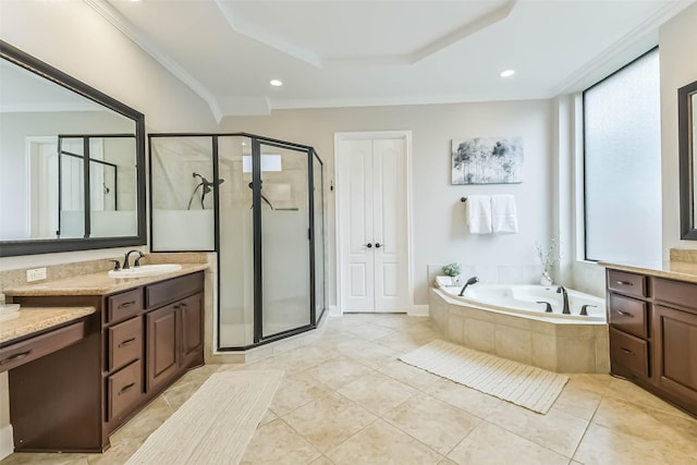 bathroom with a stall shower, a garden tub, vanity, and plenty of natural light