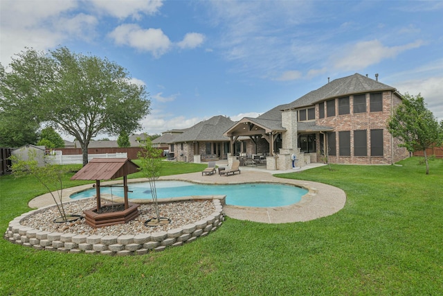 view of pool featuring a lawn, a patio, a fenced in pool, and a fenced backyard