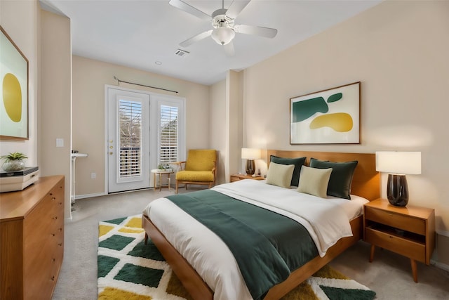 bedroom with carpet flooring, access to exterior, baseboards, visible vents, and ceiling fan