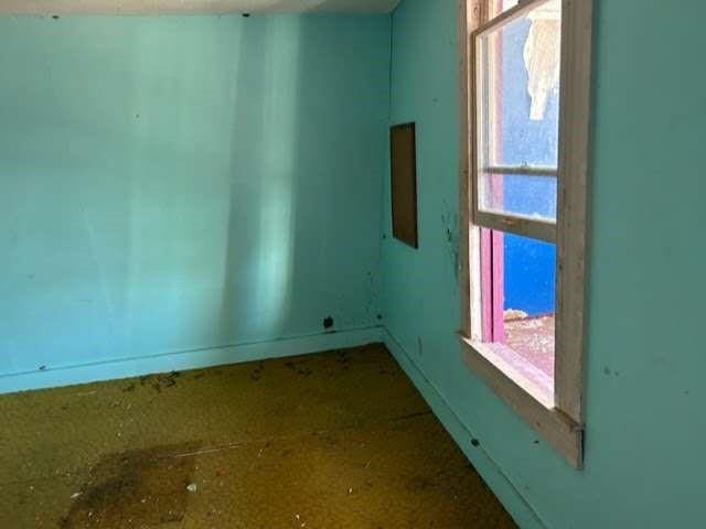 empty room with baseboards