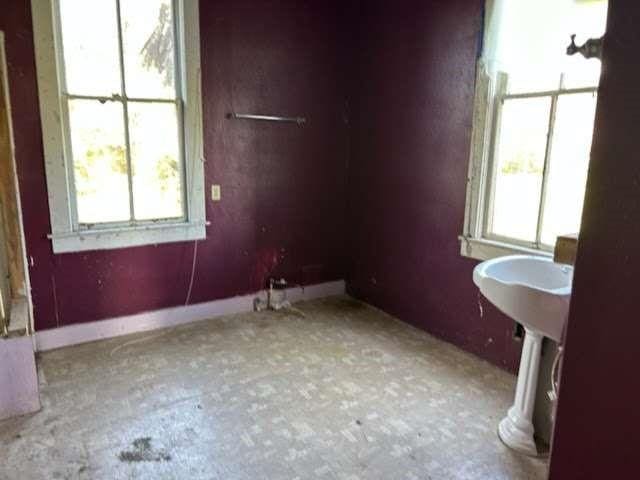 unfurnished room with plenty of natural light