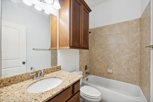 bathroom with toilet, shower / bathing tub combination, and vanity