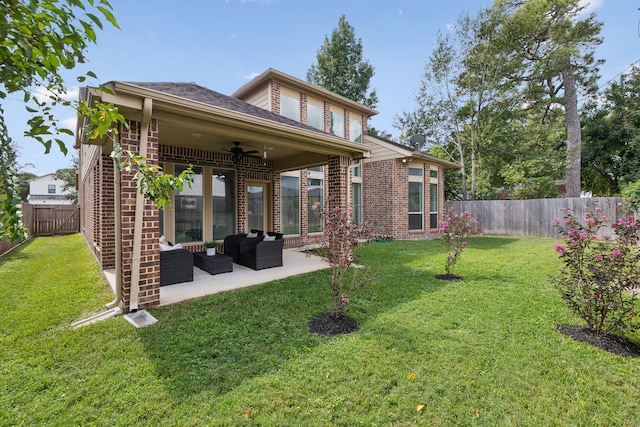 back of property featuring brick siding, an outdoor living space, a patio area, a lawn, and a ceiling fan