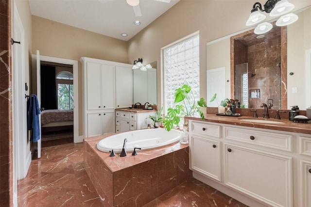 ensuite bathroom featuring a sink, ceiling fan, a stall shower, a garden tub, and marble finish floor
