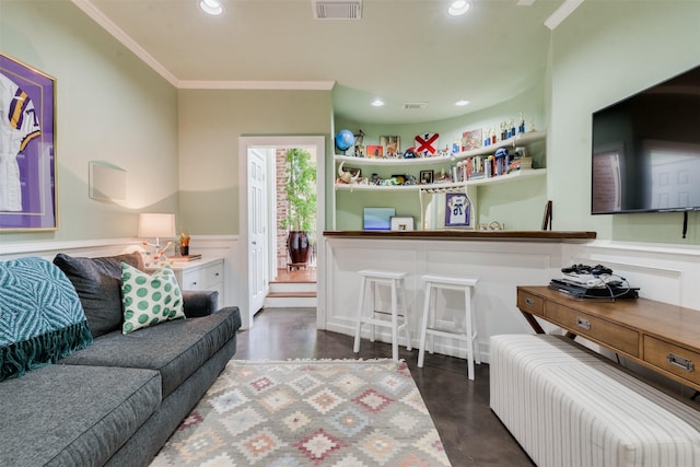 living area featuring ornamental molding, recessed lighting, visible vents, and concrete flooring