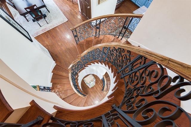 staircase featuring wood finished floors