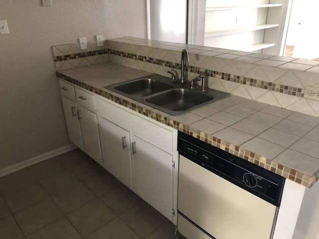 811 Buchta Rd Unit C, Angleton, TX 77515 - kitchen featuring white cabinets, a sink, backsplash, dishwasher, and tile countertops