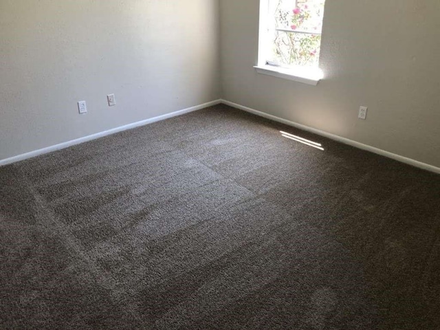 811 Buchta Rd Unit C, Angleton, TX 77515 - spare room with baseboards and carpet floors