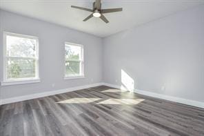 unfurnished room with baseboards, a ceiling fan, and wood finished floors