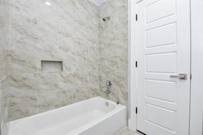 full bathroom with shower / bathtub combination