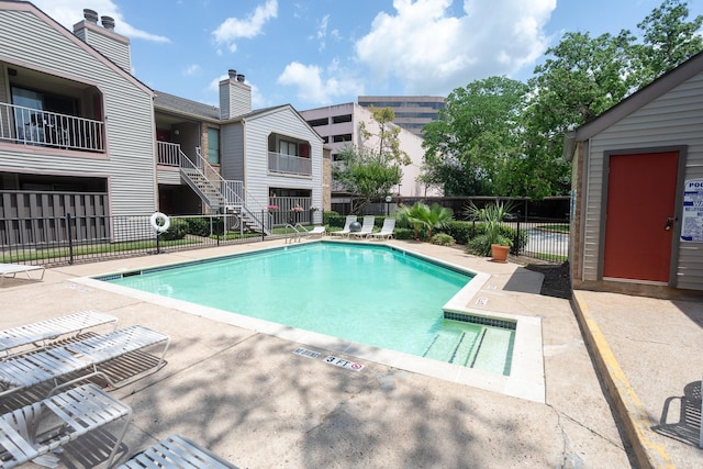 2025 Augusta Dr Unit 208, Houston, TX 77057 - community pool featuring fence and a patio area