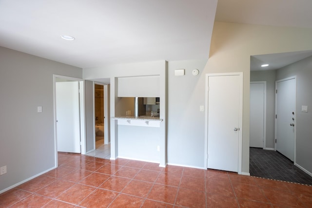 2025 Augusta Dr Unit 208, Houston, TX 77057 - tiled empty room featuring baseboards and recessed lighting
