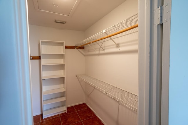 2025 Augusta Dr Unit 208, Houston, TX 77057 - walk in closet with dark tile patterned flooring and visible vents