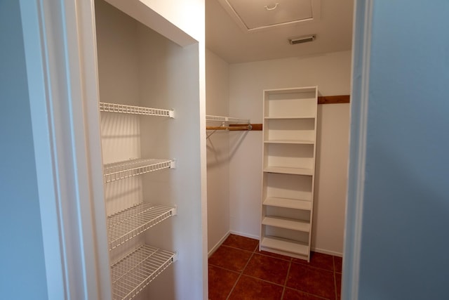2025 Augusta Dr Unit 208, Houston, TX 77057 - spacious closet featuring visible vents and dark tile patterned floors