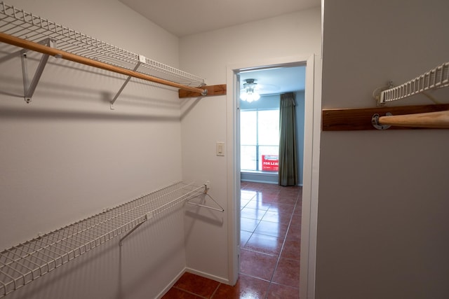 2025 Augusta Dr Unit 208, Houston, TX 77057 - spacious closet featuring dark tile patterned floors