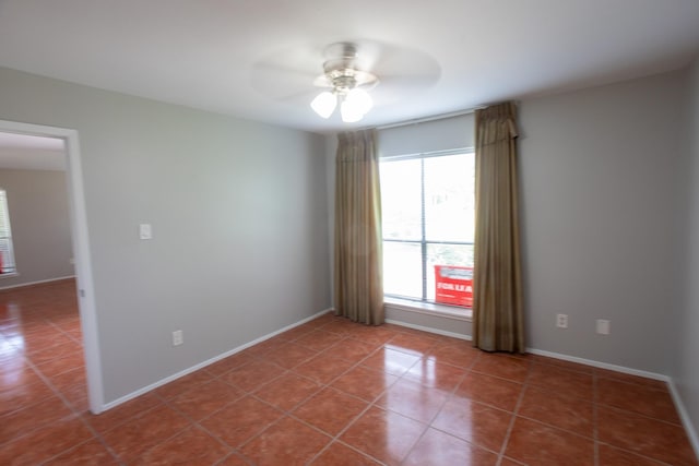 2025 Augusta Dr Unit 208, Houston, TX 77057 - spare room with a ceiling fan, baseboards, and tile patterned floors