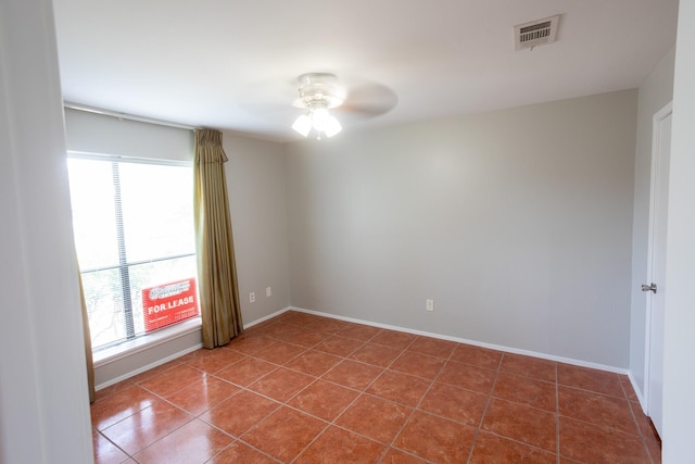2025 Augusta Dr Unit 208, Houston, TX 77057 - unfurnished room with tile patterned floors, visible vents, a ceiling fan, and baseboards