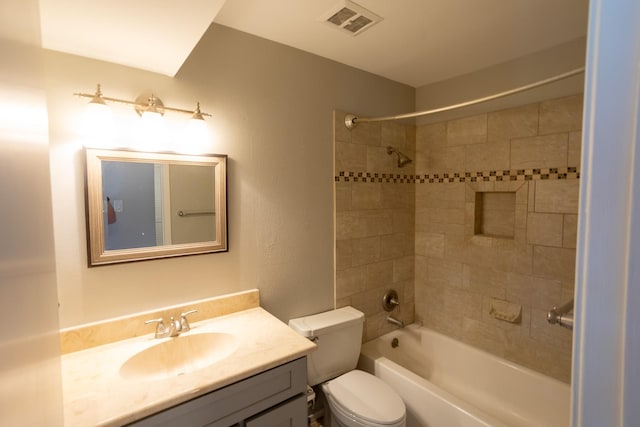 2025 Augusta Dr Unit 208, Houston, TX 77057 - bathroom featuring toilet, vanity, bathtub / shower combination, and visible vents