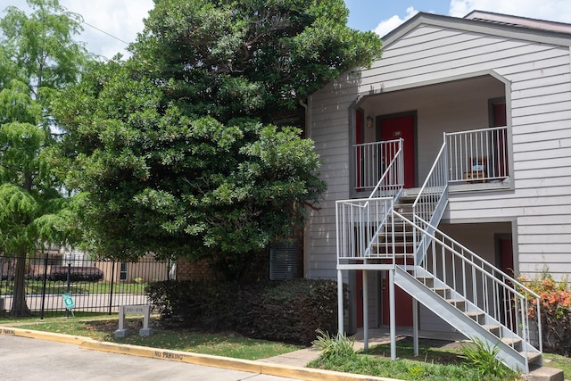 2025 Augusta Dr Unit 208, Houston, TX 77057 - view of front of home featuring fence and stairs