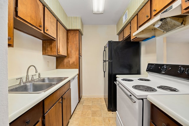 8517 Hearth Dr Unit 31, Houston, TX 77054 - kitchen featuring a sink, brown cabinets, white appliances, light countertops, and under cabinet range hood