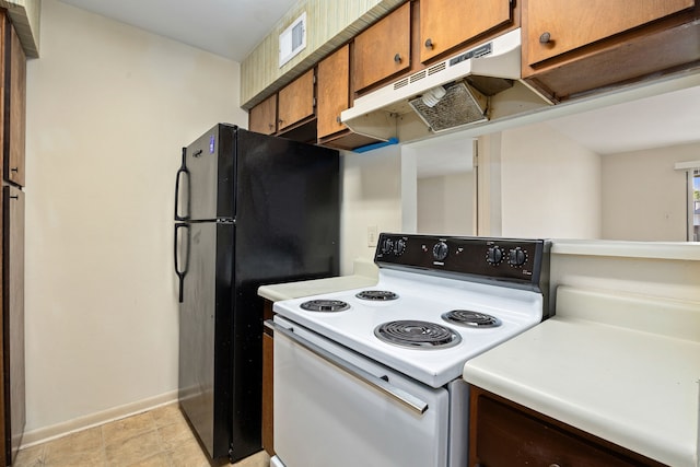 8517 Hearth Dr Unit 31, Houston, TX 77054 - kitchen featuring white electric stove, baseboards, brown cabinetry, light countertops, and under cabinet range hood