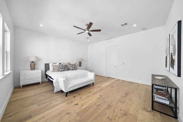 bedroom with light wood finished floors, a ceiling fan, visible vents, and recessed lighting