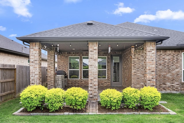 28928 Autumn Shore Dr, Fulshear, TX 77441 - doorway to property featuring brick siding and a shingled roof