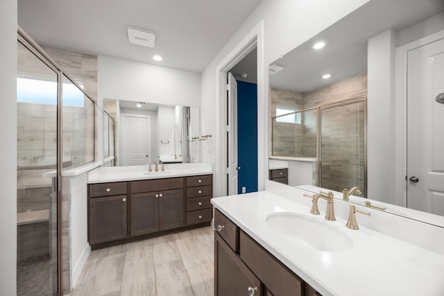 28928 Autumn Shore Dr, Fulshear, TX 77441 - bathroom featuring plenty of natural light, a stall shower, two vanities, and recessed lighting