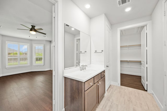 28928 Autumn Shore Dr, Fulshear, TX 77441 - bathroom featuring ceiling fan, baseboards, wood finished floors, vanity, and recessed lighting