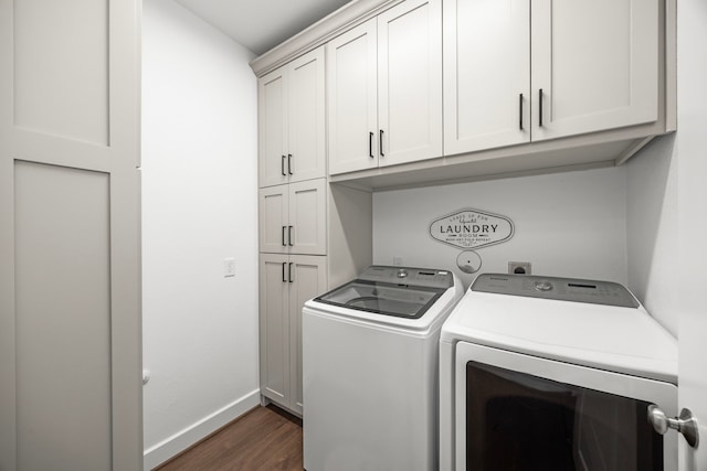28928 Autumn Shore Dr, Fulshear, TX 77441 - washroom featuring cabinet space, washer and clothes dryer, dark wood-style flooring, and baseboards