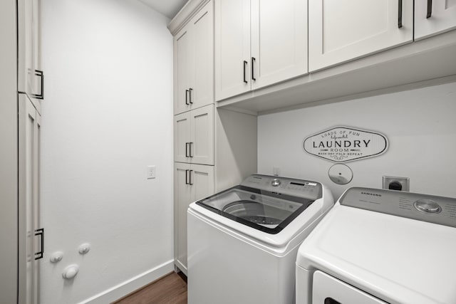 28928 Autumn Shore Dr, Fulshear, TX 77441 - laundry room featuring washer and dryer, cabinet space, dark wood-type flooring, and baseboards