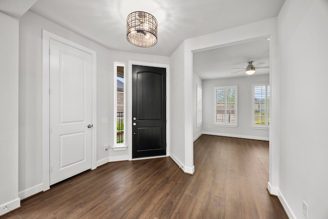 28928 Autumn Shore Dr, Fulshear, TX 77441 - foyer entrance featuring dark wood-style floors, baseboards, a chandelier, and ceiling fan