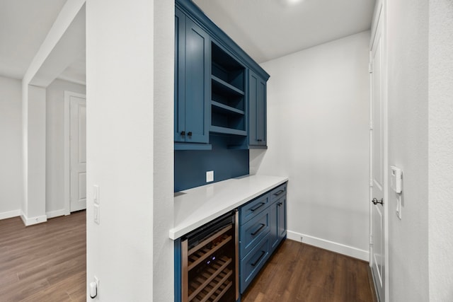 28928 Autumn Shore Dr, Fulshear, TX 77441 - indoor dry bar featuring wine cooler, dark wood-type flooring, and baseboards