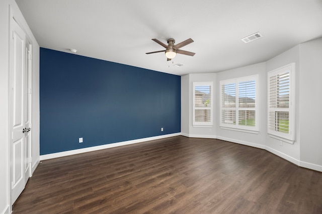 28928 Autumn Shore Dr, Fulshear, TX 77441 - unfurnished room featuring a ceiling fan, baseboards, plenty of natural light, and dark wood-style flooring