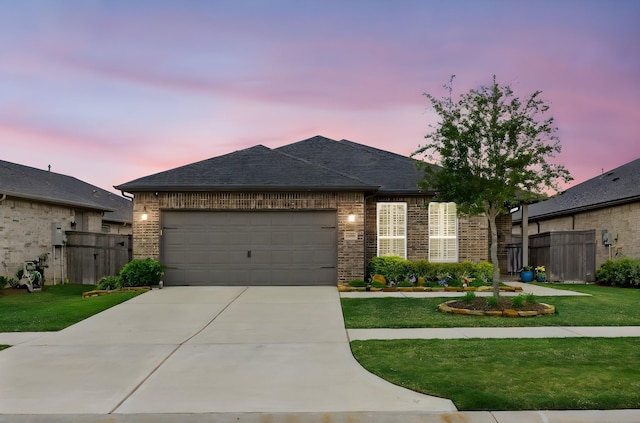 28928 Autumn Shore Dr, Fulshear, TX 77441 - french country style house with brick siding, a garage, concrete driveway, and roof with shingles