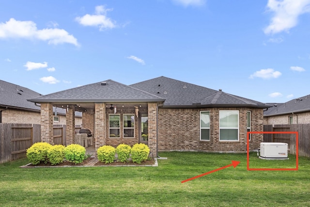 28928 Autumn Shore Dr, Fulshear, TX 77441 - rear view of house with brick siding and roof with shingles