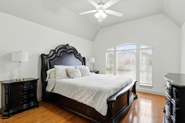 16311 Perry Pass Ct, Spring, TX 77379 - bedroom with vaulted ceiling, light wood finished floors, a ceiling fan, and baseboards