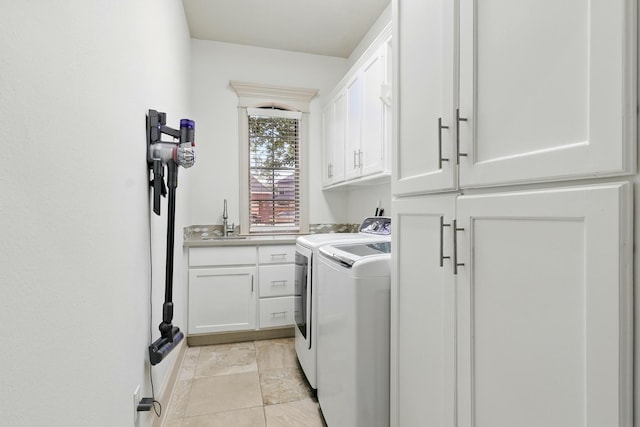 16311 Perry Pass Ct, Spring, TX 77379 - washroom with cabinet space and washer and dryer