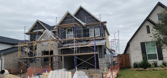 back of house with fence and brick siding