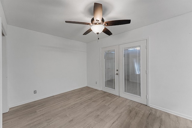11887 Algonquin Dr, Houston, TX 77089 - spare room featuring french doors, ceiling fan, light wood finished floors, and baseboards