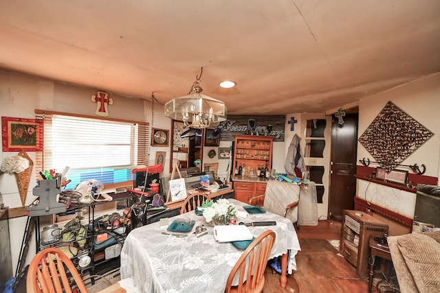 16777 Stinson Ln, Montgomery, TX 77316 - dining space featuring wood finished floors and an inviting chandelier