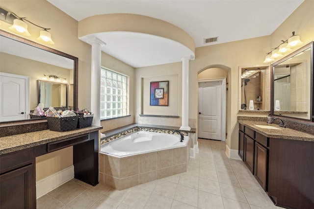 514 Whitney Oaks Ln, Stafford, TX 77477 - full bathroom featuring tile patterned floors, a tile shower, visible vents, ornate columns, and a garden tub