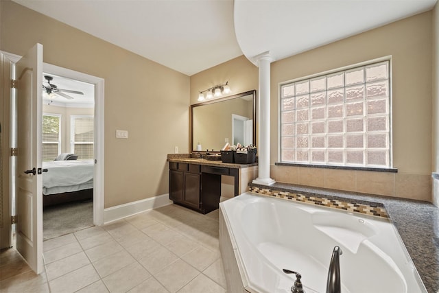 514 Whitney Oaks Ln, Stafford, TX 77477 - ensuite bathroom with a garden tub, a ceiling fan, vanity, ensuite bath, and decorative columns
