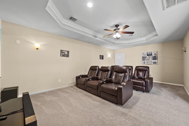 514 Whitney Oaks Ln, Stafford, TX 77477 - home theater room with a ceiling fan, visible vents, carpet floors, and a tray ceiling