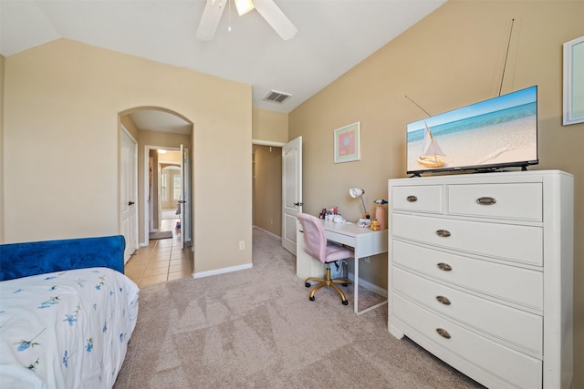 514 Whitney Oaks Ln, Stafford, TX 77477 - bedroom with lofted ceiling, visible vents, light carpet, arched walkways, and baseboards