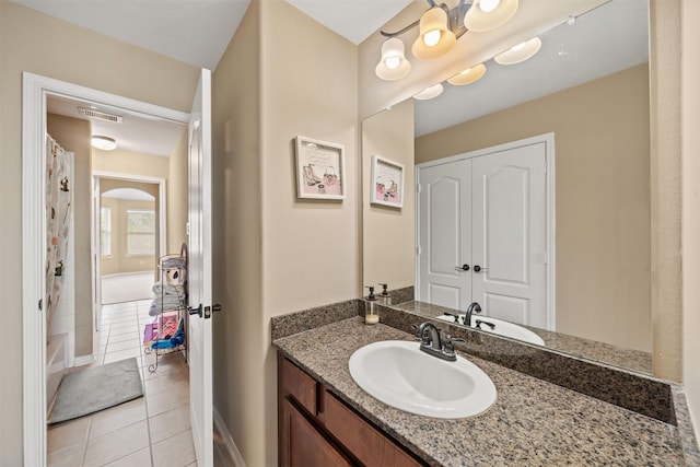 514 Whitney Oaks Ln, Stafford, TX 77477 - bathroom featuring tile patterned floors, visible vents, vanity, a shower with curtain, and baseboards