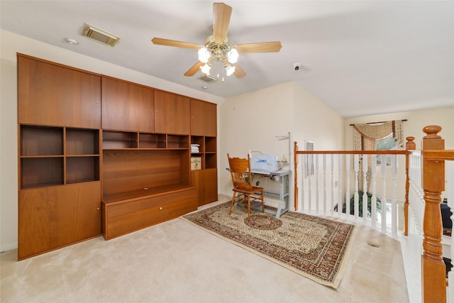 office featuring carpet, visible vents, and a ceiling fan