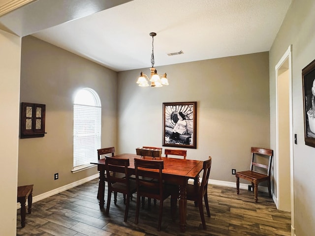 dining room with visible vents, baseboards, a chandelier, and dark wood-type flooring