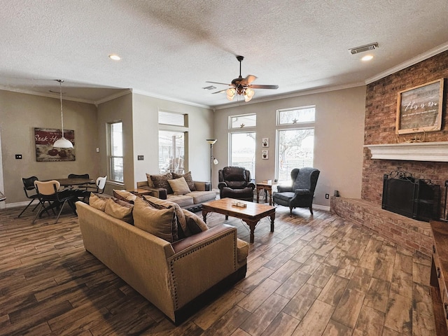 living room with a textured ceiling, visible vents, ceiling fan, and dark wood finished floors