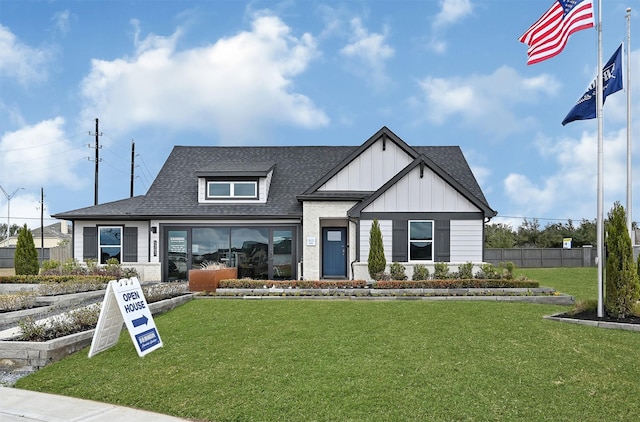 2707 Misty Elm Ln, Rosenberg, TX 77469 - modern farmhouse style home with board and batten siding and roof with shingles